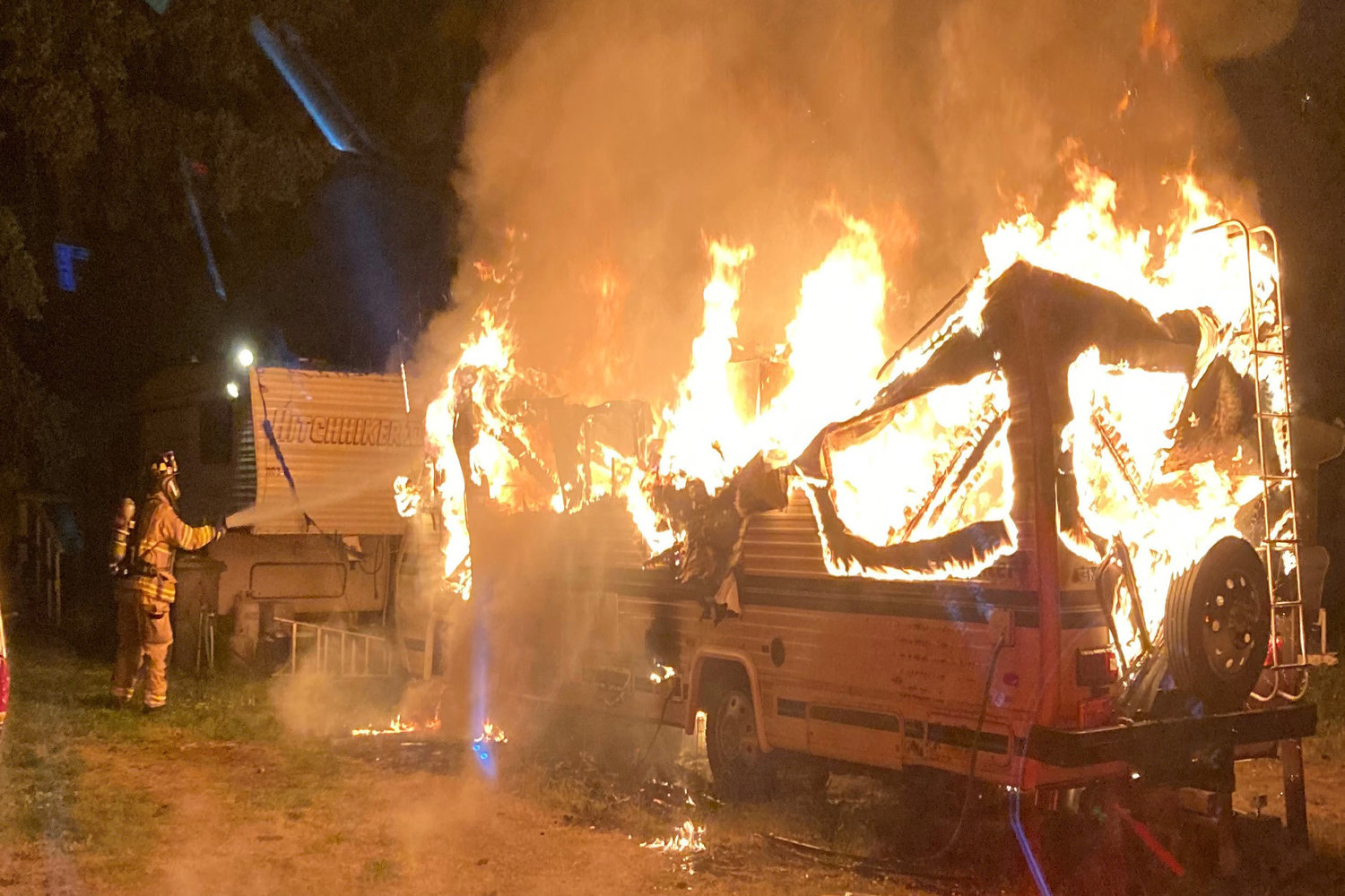 Firefighters extinguish a motorhome fire in Port Hadlock-Irondale Thursday morning.